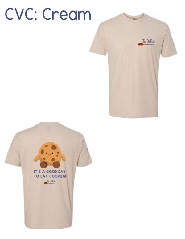 A tan t-shirt with an image of a cookie.