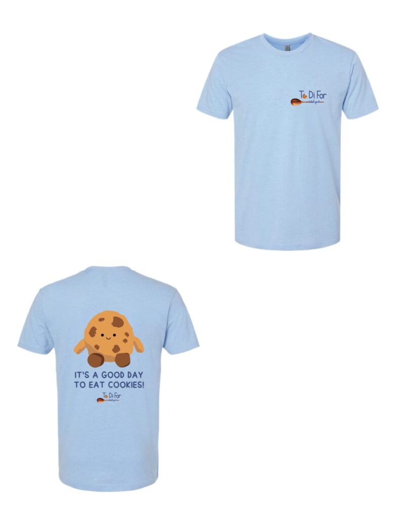 A light blue t-shirt with a picture of a cookie.