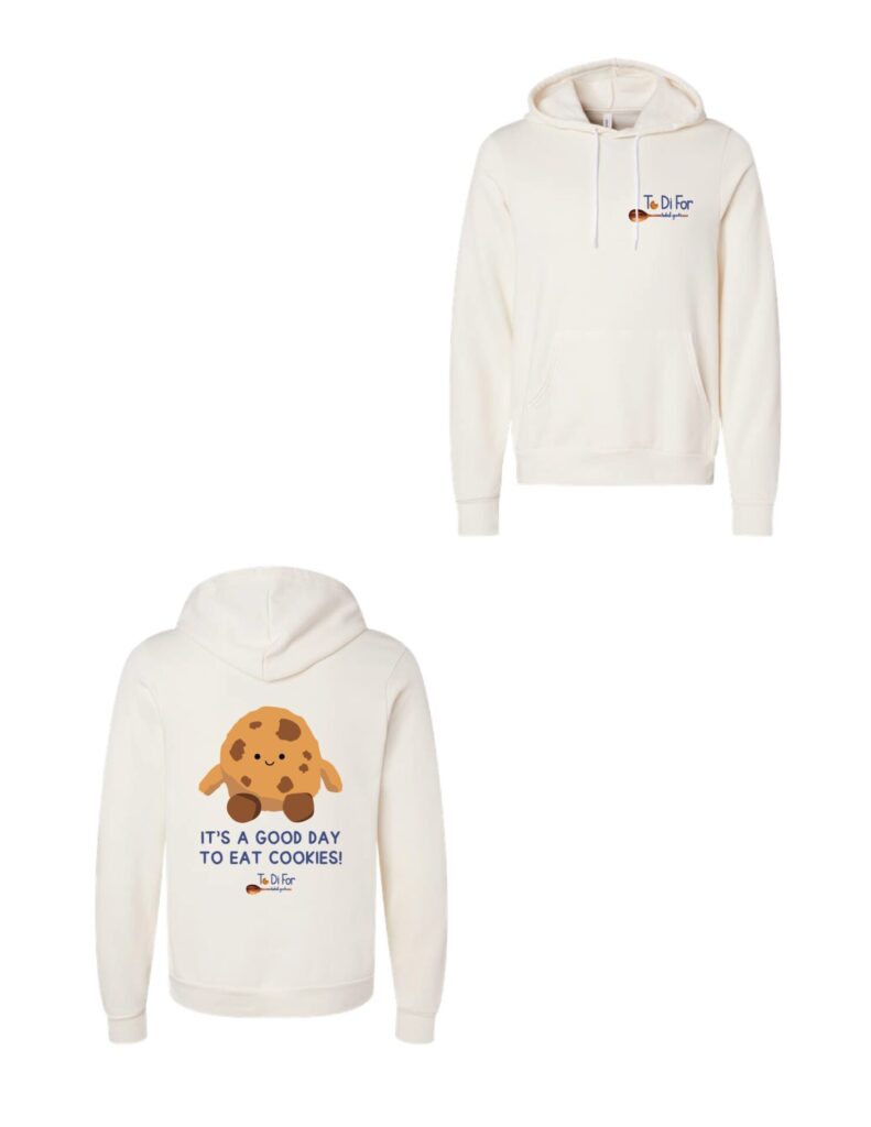 A white hoodie with a picture of cookies on it.